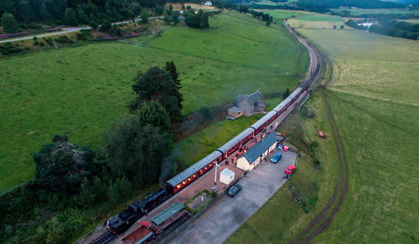 Aerial view of Broomhill - "Glenbogle" station with Locomotive 46512 standing at station